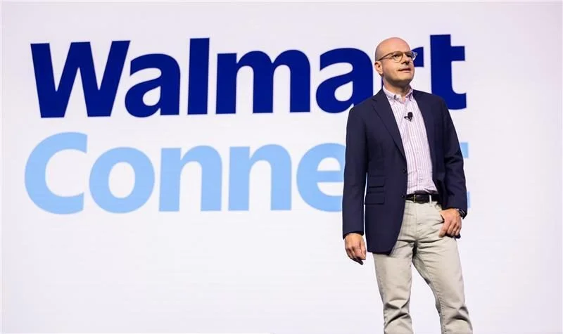 Man standing in front of the Walmart Connect logo