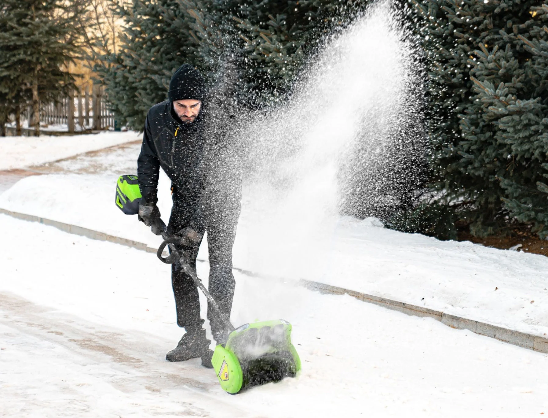 man plowing snow