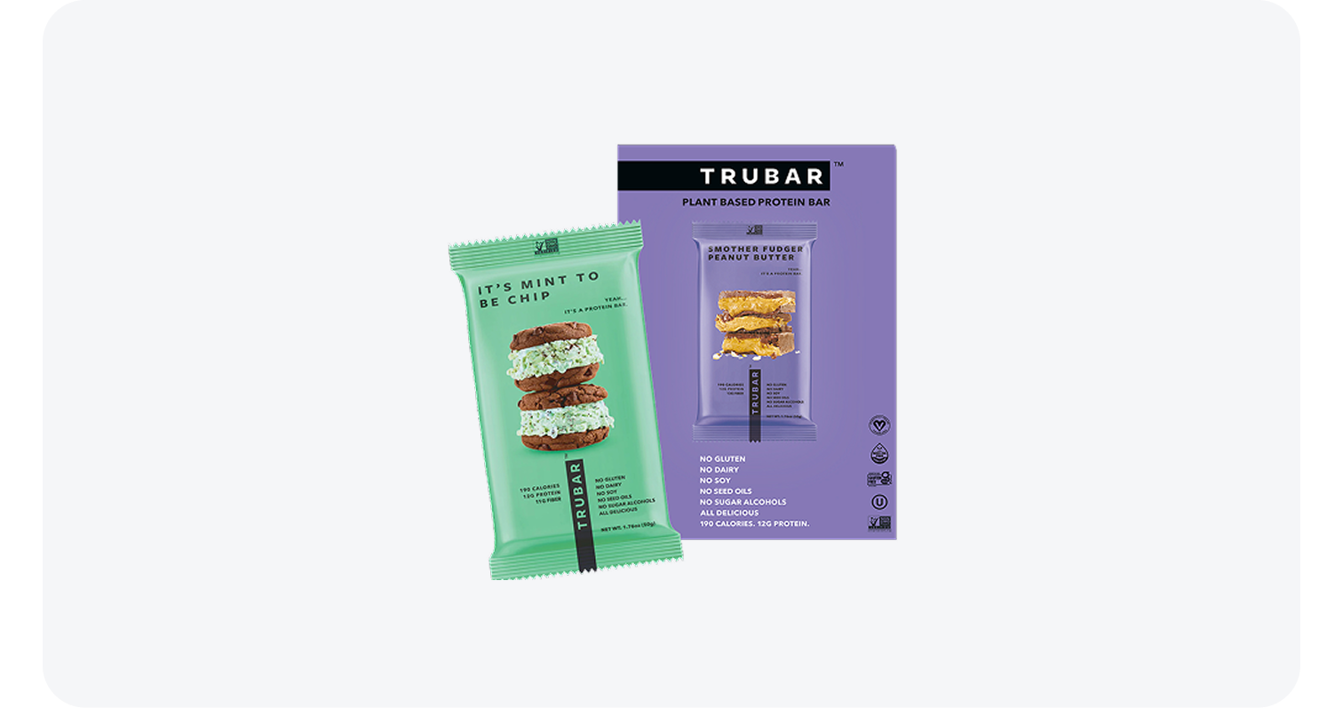 Trubar plant-based protein bar packaging in mint green and purple with dessert images.