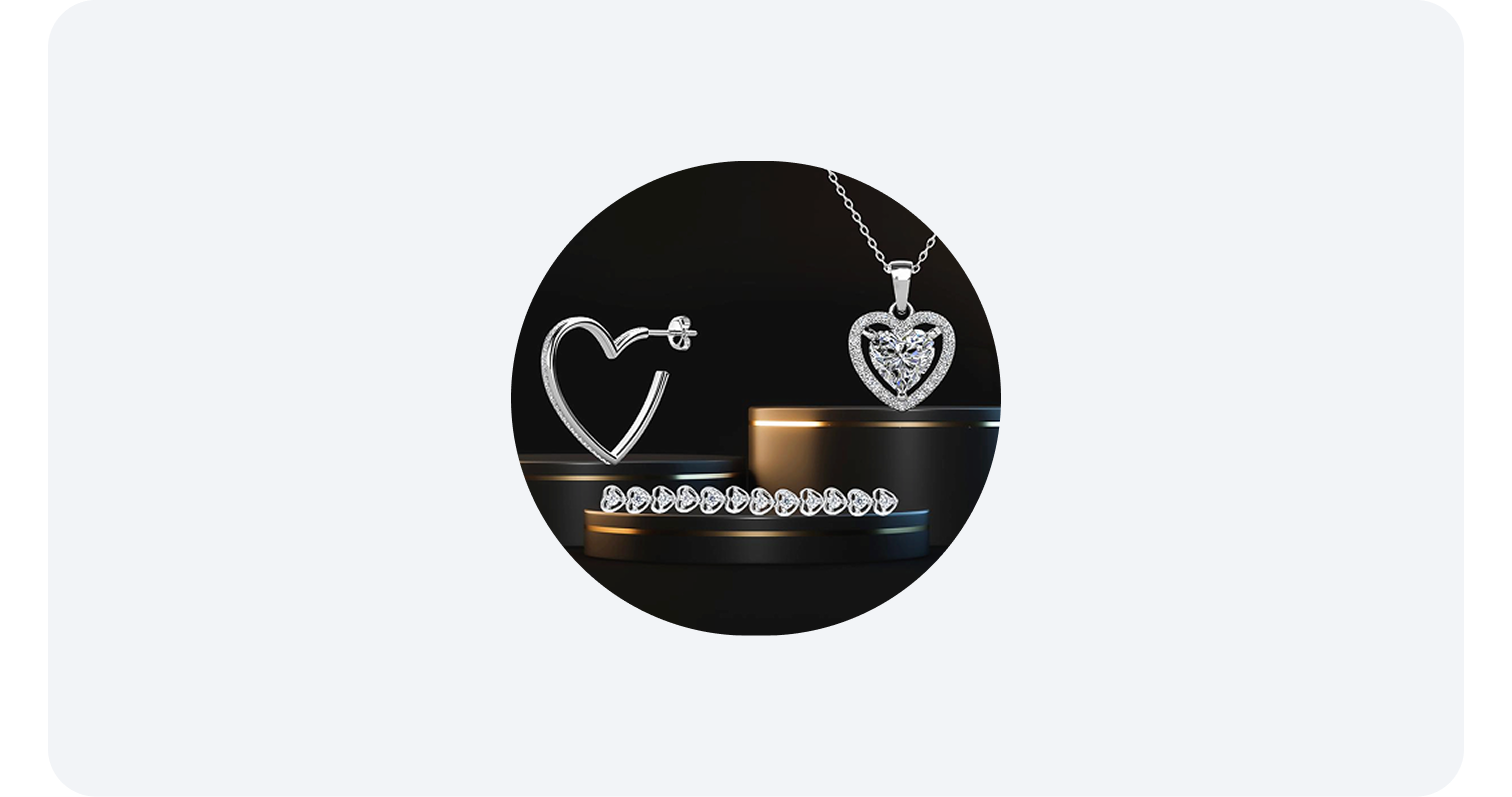  Heart-shaped silver jewelry set with earrings, a necklace, and a bracelet on black stands.