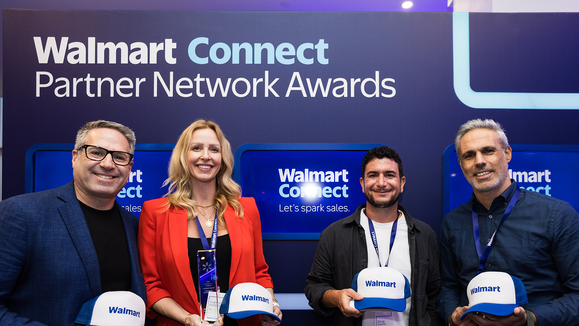 three men and a woman holding hats