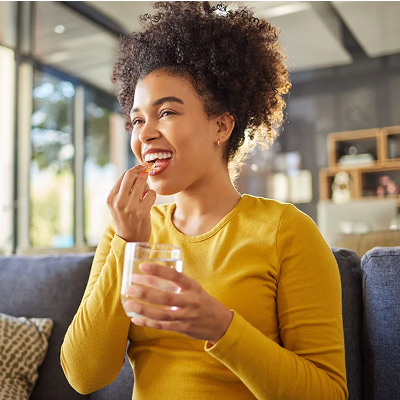 woman taking a vitamin