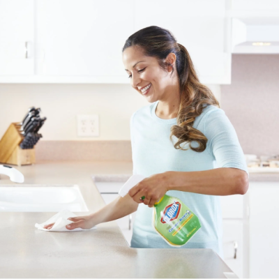 woman cleaning counter top