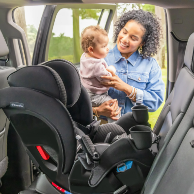 woman baby with car seat