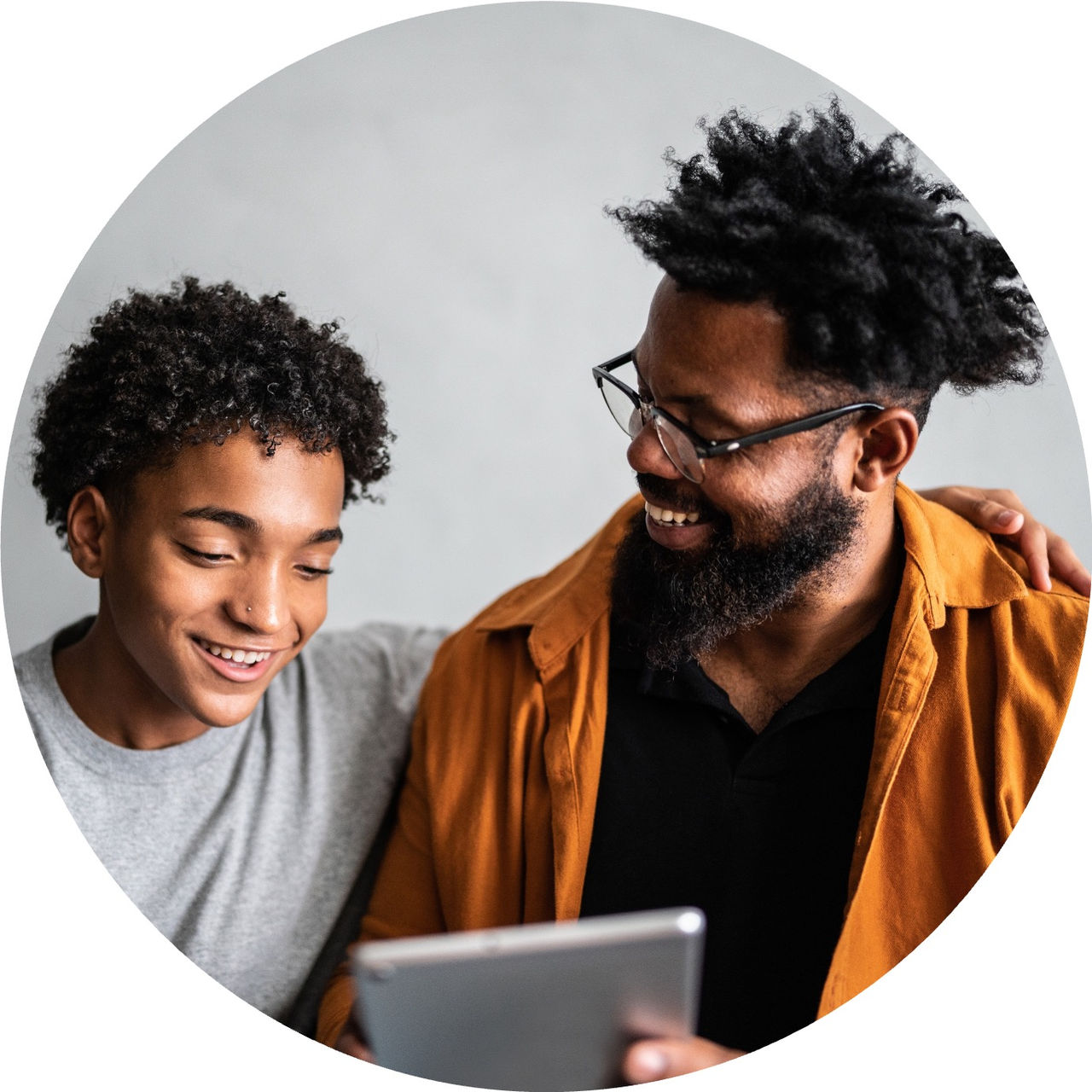dad and son with tablet